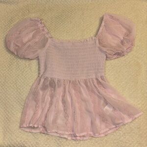 Francesca’s light pink sheer top